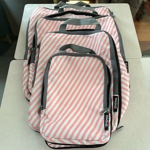 Packing cube compression style 4 piece set pink and white stripes.